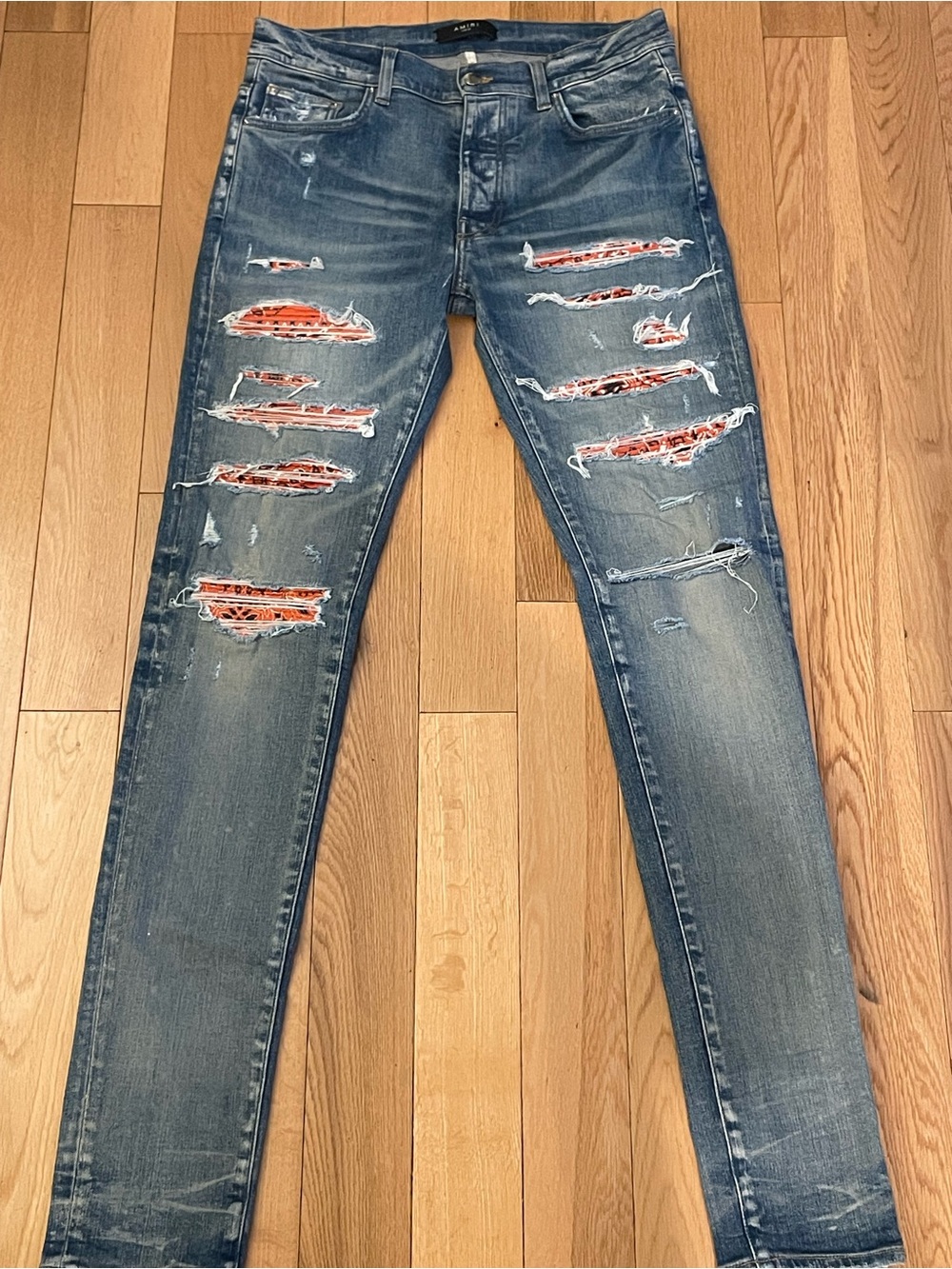 AMIRI Men's Distressed Blue Jeans with Orange Patch Details